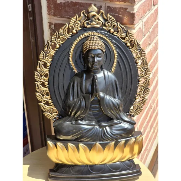 Serene Buddha Statue with Golden Amulet
